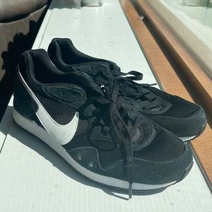 Nike black running shoes.